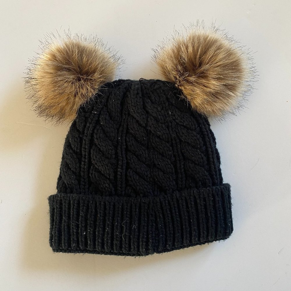 Women's black, cable knit beanie with poof ears and fleece lining EUC.